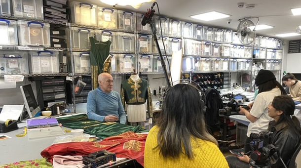 A camera crew film behind the scenes of Don Quixote