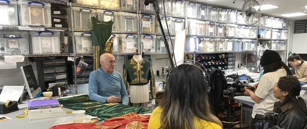 A camera crew film behind the scenes of Don Quixote