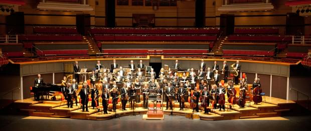 Royal Ballet Sinfonia playing on the stage at Symphony Hall, Birmingham