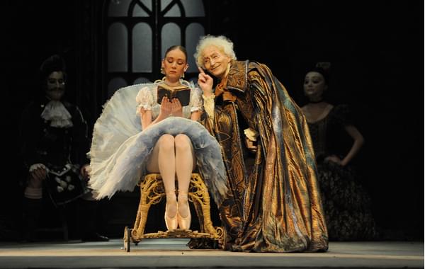 David Morse in the character of the Dr Coppélius, with Elisha Willis as Swanilda, in Coppélia