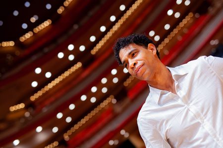 Carlos Acosta stands in the empty Symphony Hall auditorium
